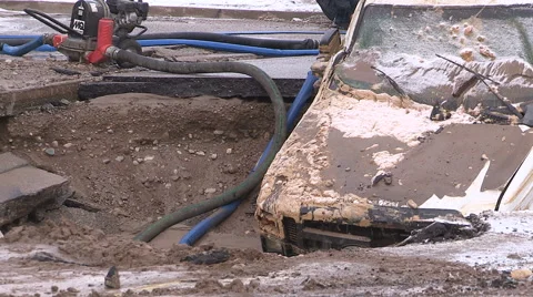 Car damaging large potholes on city streets Stock Footage 60060932