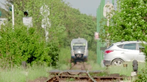 Car danger passing in front of approaching train Video stock 107810628