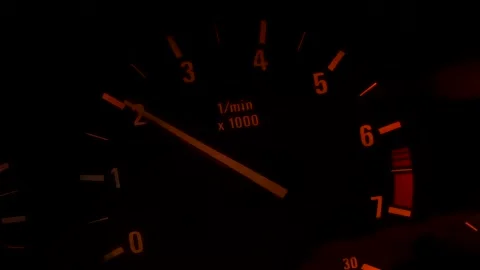 Car dashboard and speedometer with moving red arrow on zero while the automobile Vidéo 133959446