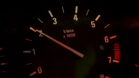 Car dashboard and speedometer with moving red arrow on zero while the automobile Vidéo 133959579