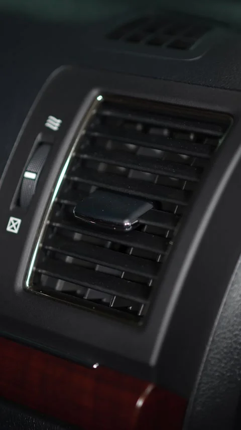 Car dashboard central air vent with adjustable horizontal louvers, a directio Stock Footage 344597153