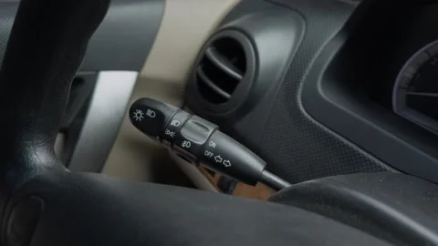 The Car Dashboard Control Lever Functions for Lights and Indicators on Your Stock Footage 309421673