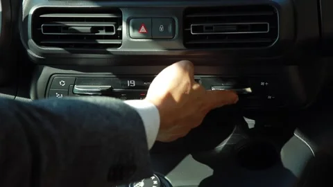 Car dashboard. The driver presses the buttons on the panel. Close-up Stock Footage 141432963