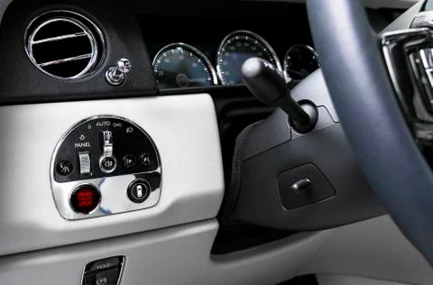 Car dashboard with focus on engine start stop button. Modern car white leathe Foto stock