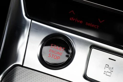 Car dashboard with focus on engine start stop button. Modern car interior d.. Stock Photos
