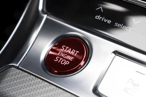Car dashboard with focus on engine start stop button. Modern car interior d.. Stock Photos