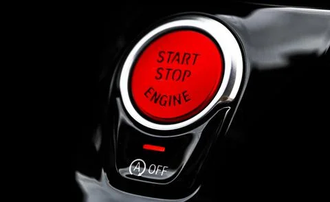 Car dashboard with focus on red engine start stop button. Modern car interi.. Stock Photos