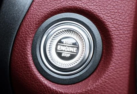 Car dashboard with focus on red engine start stop button. Modern car interi.. Stock Photos