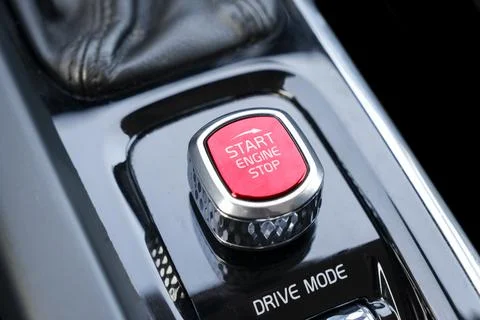 Car dashboard with focus on red engine start stop button. Modern car interi.. Foto stock