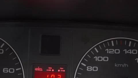 Car dashboard with hazard lights blinking and speedometer Stock Footage 327402714