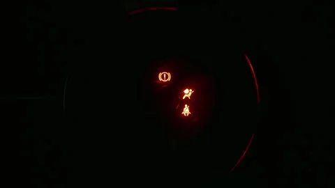Car dashboard illuminates showing speedometer, fuel gauge, and warning lights. Stock Footage 322048956