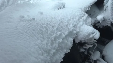 Car dashboard interior covered in thick white snow Stock Footage 319554877
