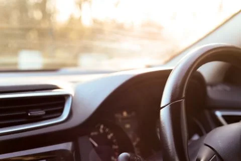 Car dashboard interior view of inside the vehicle including steering wheel di Stock Photos