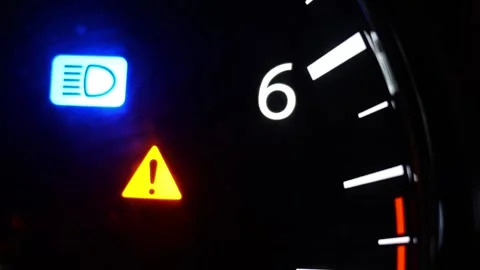 Car dashboard master warning light and high beam indicator close up Stock Footage 337309467