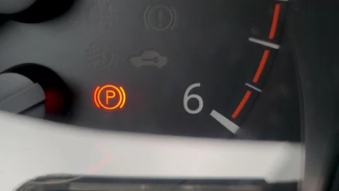 Car dashboard with red blinking icons of electric parking brake and car security Stock Footage 220919801