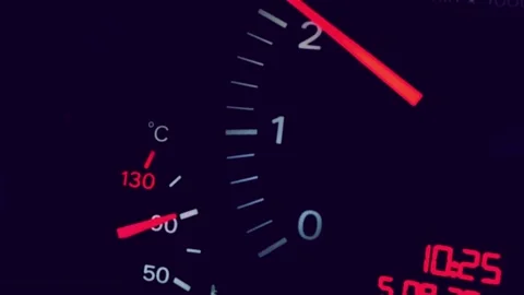 Car dashboard speedometer and temperature gauge at night. Stock Footage 340462149