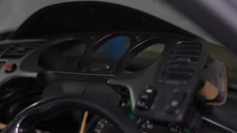 Car dashboard switches panel with fog light button partially removed. Stock Footage 344362229