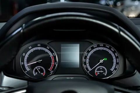 Car dashboard with white  backlight: Odometer, speedometer, tachometer, fuel  Foto stock