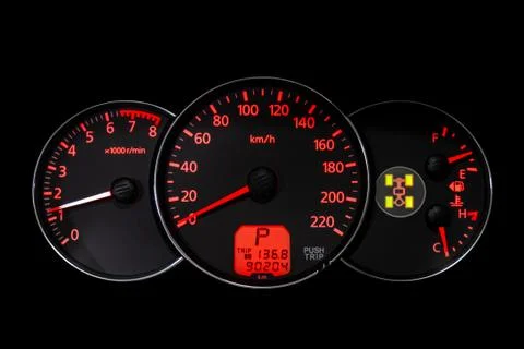 Car dashboard wuth red backlight: Odometer, speedometer, tachometer, fuel lev Stock Photos