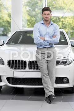 At The Car Dealer, Man Leaning Against New Car
