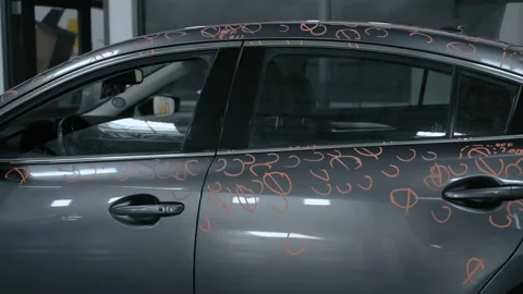 Car with dent marks. Preparing to Repairing Hail Damage in car body shop Stock Footage 335966643