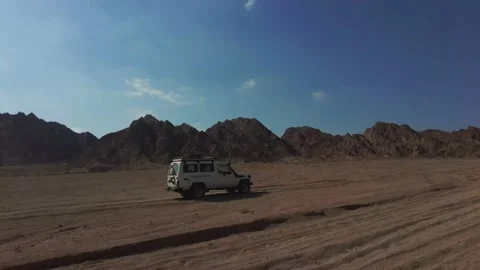 Car in a desert Stock Footage 157876895