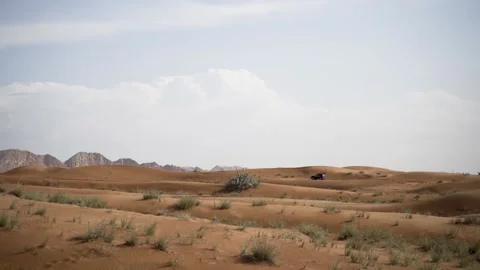 Car in desert safari and rock slow motion Stock Footage