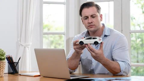 Car design engineer analyze car model prototype. Synchronos Stock Photos