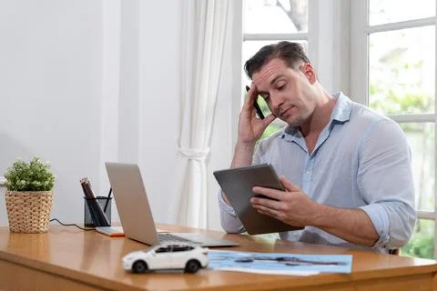 Car design engineer analyze car model prototype. Synchronos Stock Photos