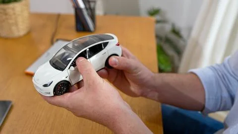 Car design engineer analyze car model prototype. Synchronos Stock Photos