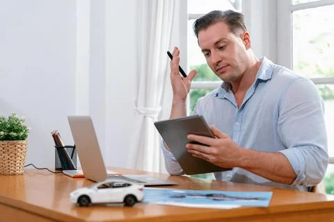 Car design engineer analyze car model prototype. Synchronos Stock Photos