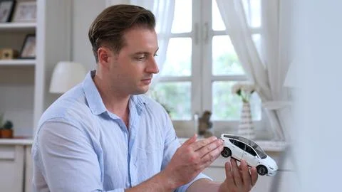 Car design engineer analyze car model prototype. Synchronos Stock Photos
