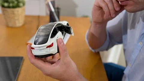 Car design engineer analyze car model prototype. Synchronos Stock Photos