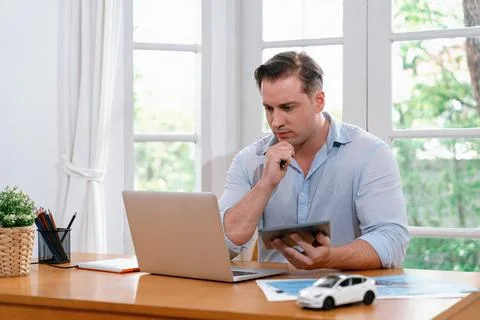 Car design engineer analyze car model prototype. Synchronos Stock Photos