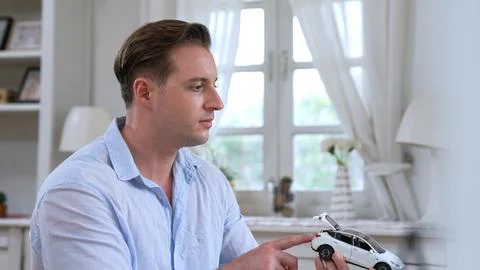 Car design engineer analyze car model prototype. Synchronos Stock Photos