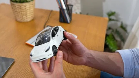 Car design engineer analyze car model prototype. Synchronos Stock Photos
