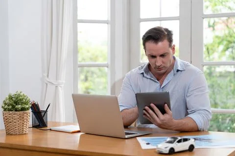 Car design engineer analyze car model prototype. Synchronos Stock Photos