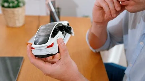 Car design engineer analyze car model prototype. Synchronos Stock Photos