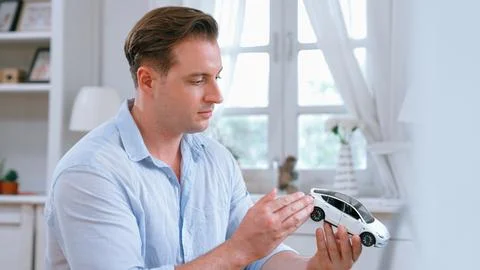 Car design engineer analyze car model prototype. Synchronos Stock Photos