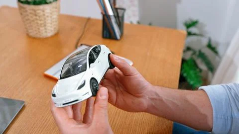 Car design engineer analyze car model prototype. Synchronos Stock Photos
