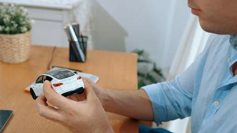 Car design engineer analyze car model prototype. Synchronos Stock Photos