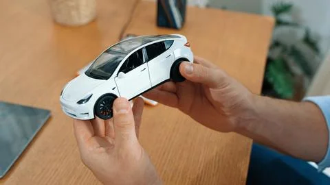 Car design engineer analyze car model prototype. Synchronos Stock Photos
