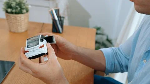 Car design engineer analyze car model prototype. Synchronos Stock Photos