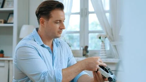 Car design engineer analyze car model prototype. Synchronos Stock Photos