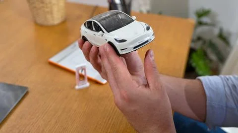 Car design engineer analyze car model prototype. Synchronos Stock Photos