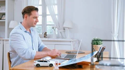 Car design engineer working on car prototype for automobile business Synchronos Stock Photos