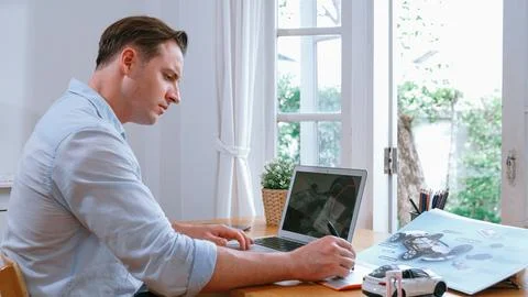 Car design engineer working on car prototype for automobile business Synchronos Stock Photos