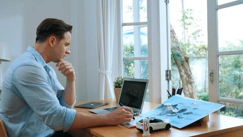 Car design engineer working on car prototype for automobile business Synchronos Stock Photos