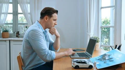 Car design engineer working on car prototype for automobile business Synchronos Stock Photos