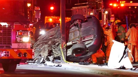 Car destroyed after rollover damaging car Stock Footage 114946516